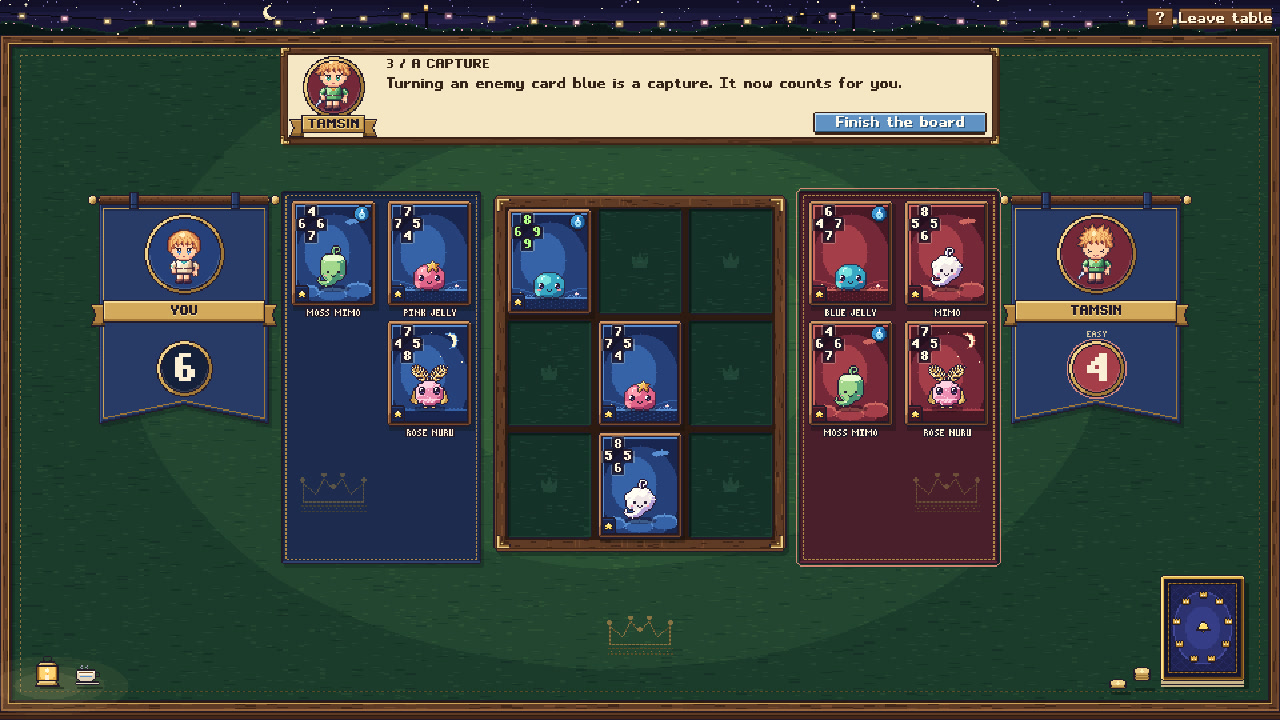 A Nine Crowns match in the game: cards on a board of nine squares, with each player’s hand beside it.